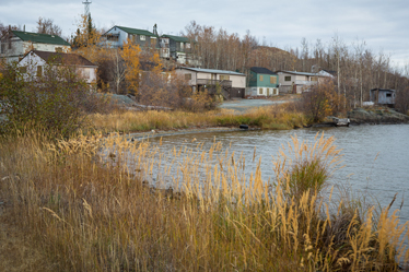 Abandoned houses at the Giant Mine townsite stand empty on the shore of Great Slave Lake.